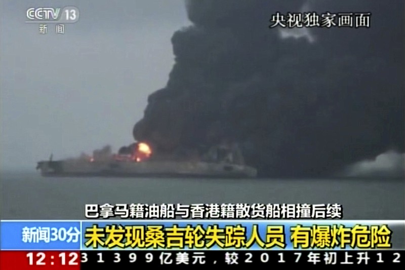 In this image from video run by China's CCTV shows the Panama-registered tanker "Sanchi" is seen ablaze after a collision with a Hong Kong-registered freighter off China's eastern coast, Monday, Jan. 8, 2017. The U.S. Navy has joined the search for 32 crew members missing from the oil tanker that caught fire after colliding with a bulk freighter off China's east coast. (CCTV via AP Video)