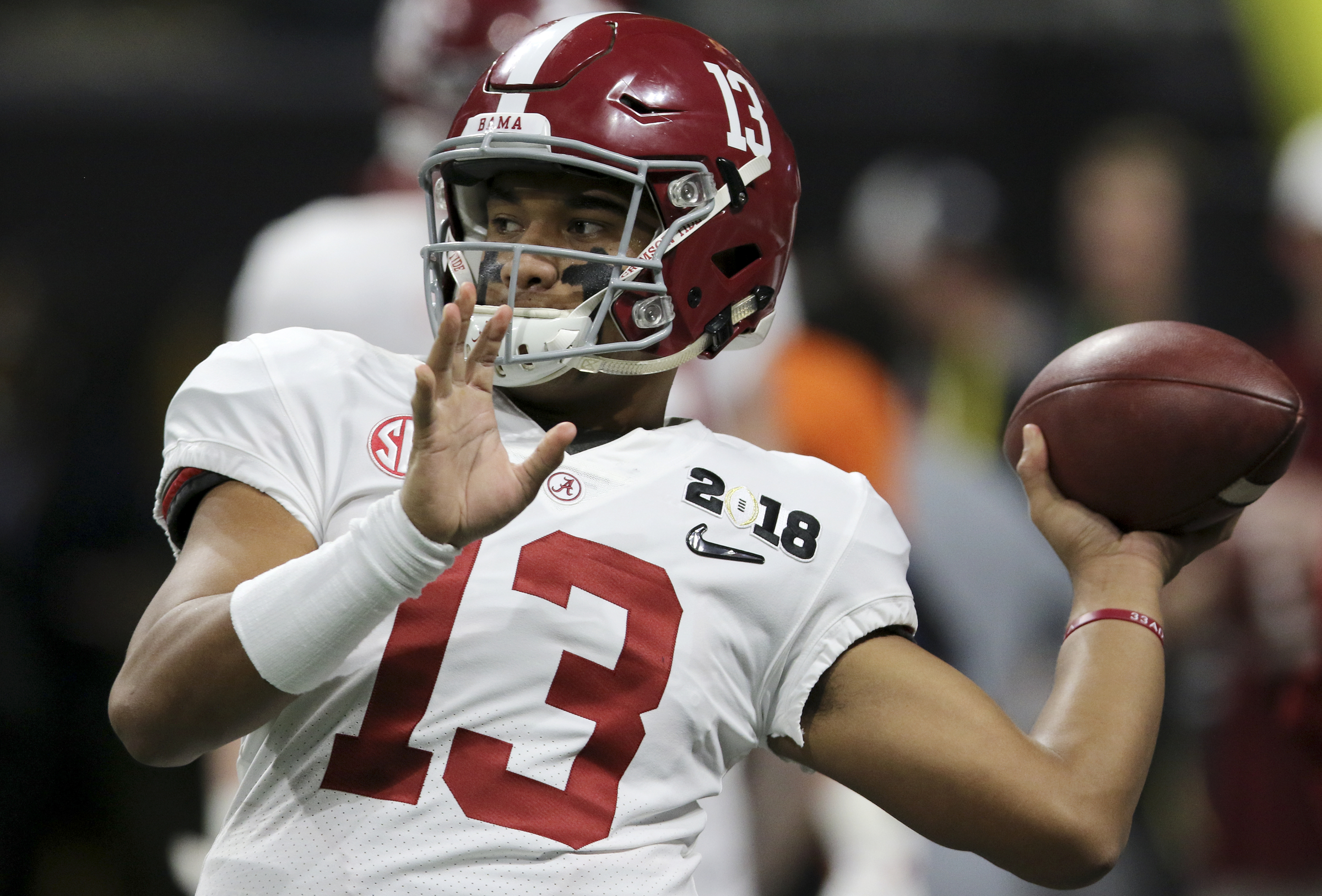 Alabama quarterback Tua Tagovailoa (13) warms up before facing off against Georgia in the College Football Playoff national championship at Mercedes-Benz Stadium on Monday, Jan. 8, 2018 in Atlanta, Ga.