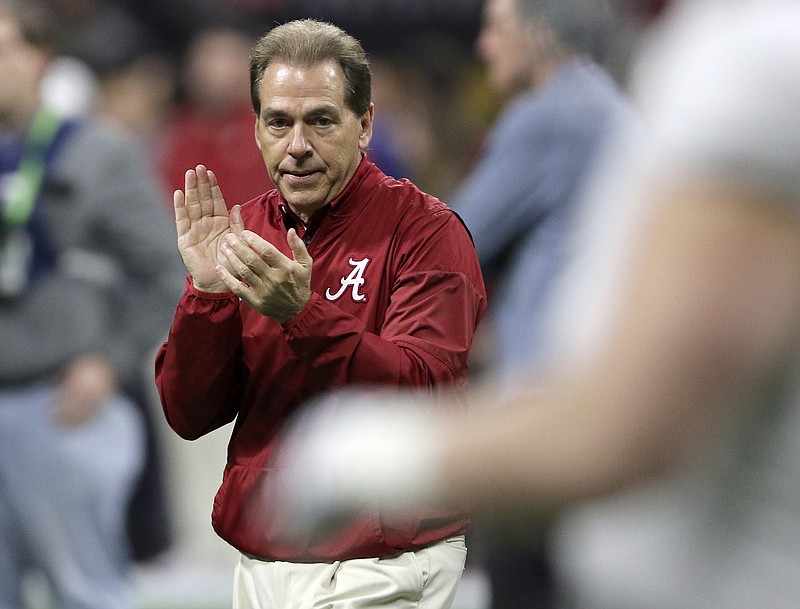 Alabama head coach Nick Saban claps as his team warms up before taking on Georgia in the College Football Playoff national championship at Mercedes-Benz Stadium on Monday, Jan. 8, 2018 in Atlanta, Ga.