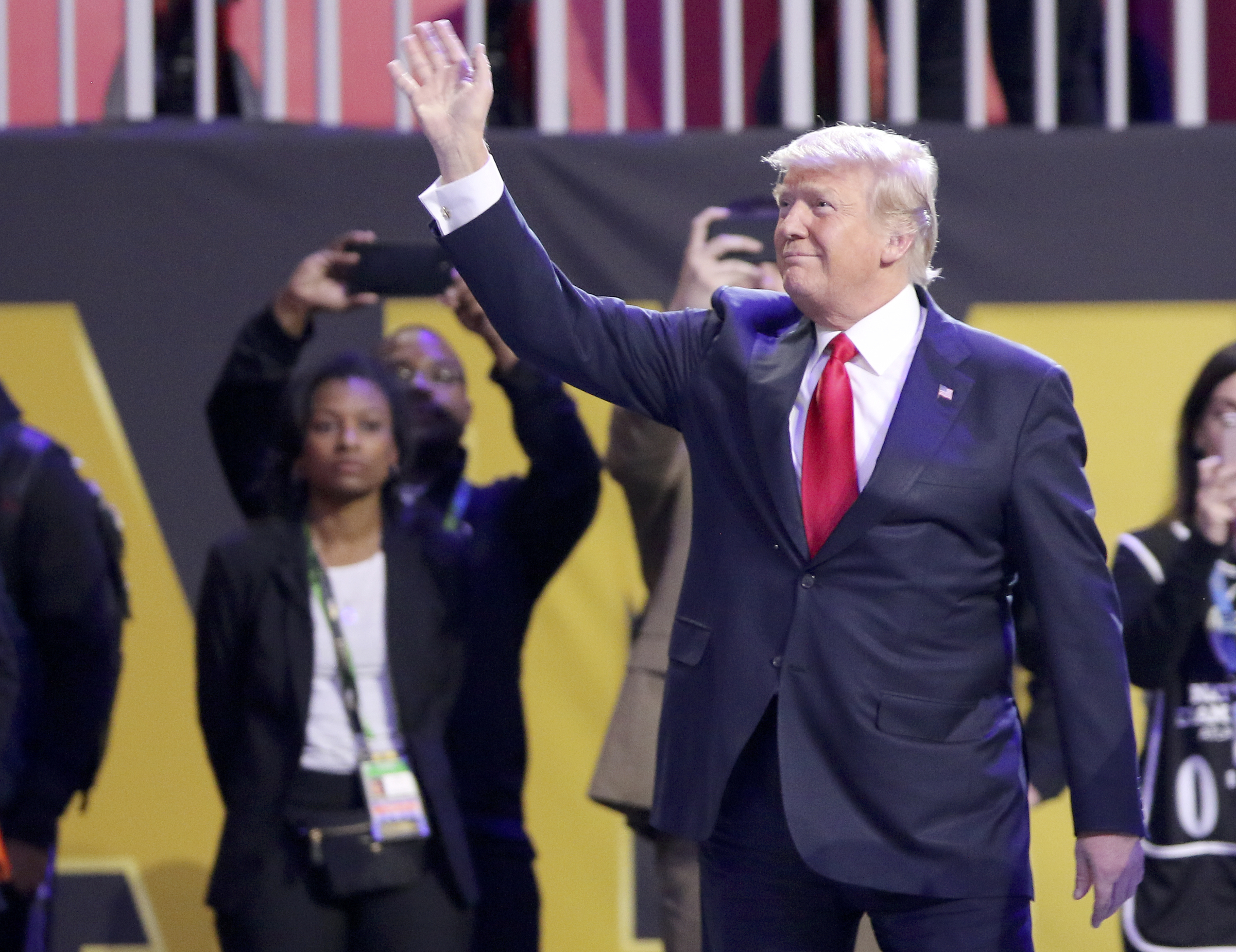 President Donald Trump waves to the crowd before the national anthem before the College Football Playoff national championship between Georgia and Alabama at Mercedes-Benz Stadium on Monday, Jan. 8, 2018 in Atlanta, Ga.