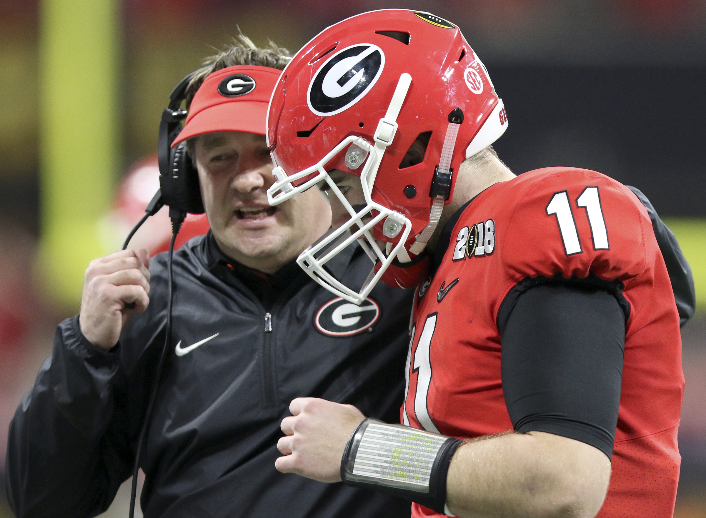 Georgia head coach Kirby Smart talks to quarterback Jake Fromm (11) after the Georgia offense failed to convert a third down against Alabama College Football Playoff national championship at Mercedes-Benz Stadium on Monday, Jan. 8, 2018 in Atlanta, Ga.