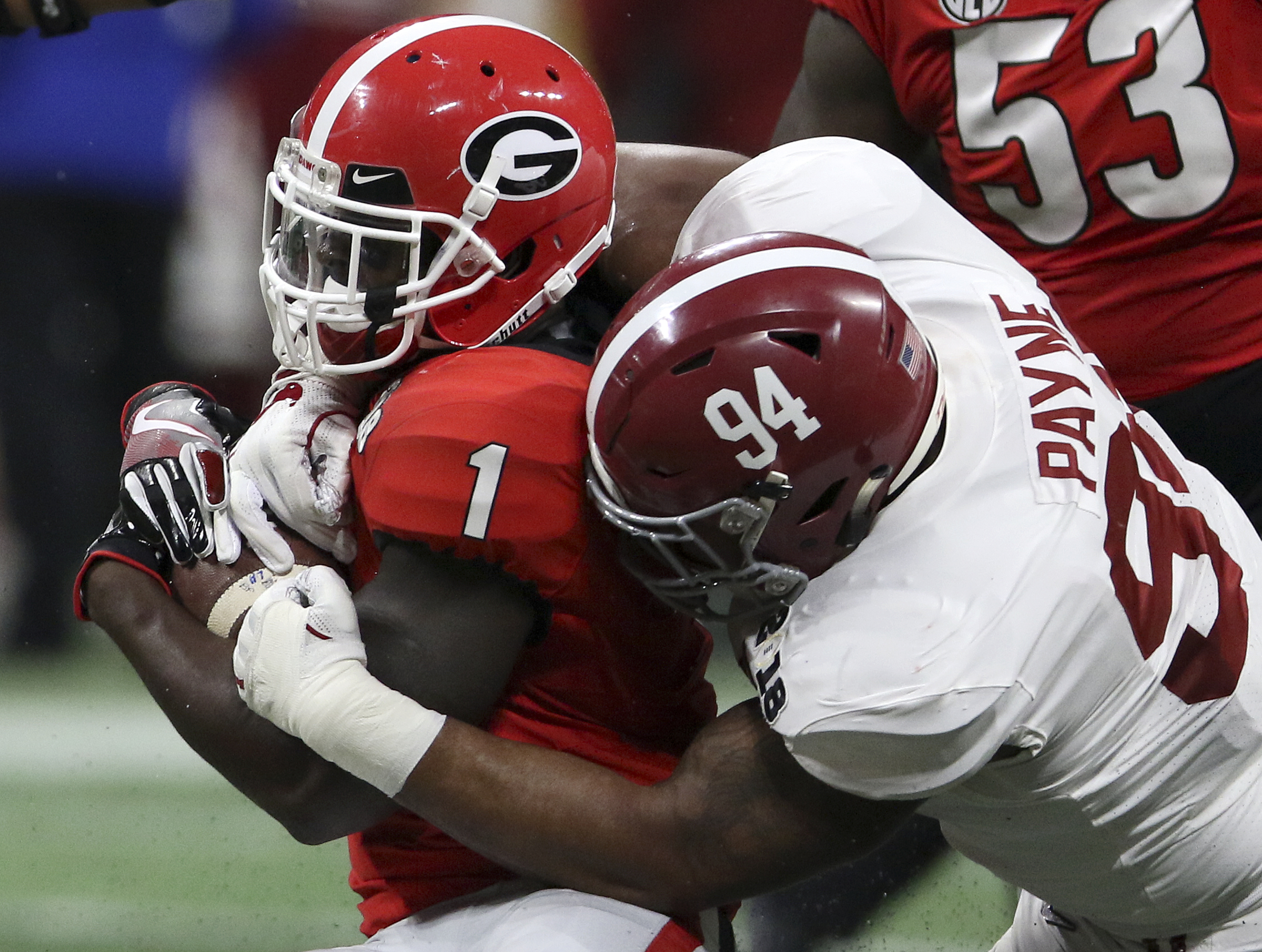 Alabama defensive lineman Da'Ron Payne (94) stops Georgia running back Sony Michel (1) for no gain during the College Football Playoff national championship at Mercedes-Benz Stadium on Monday, Jan. 8, 2018 in Atlanta, Ga.