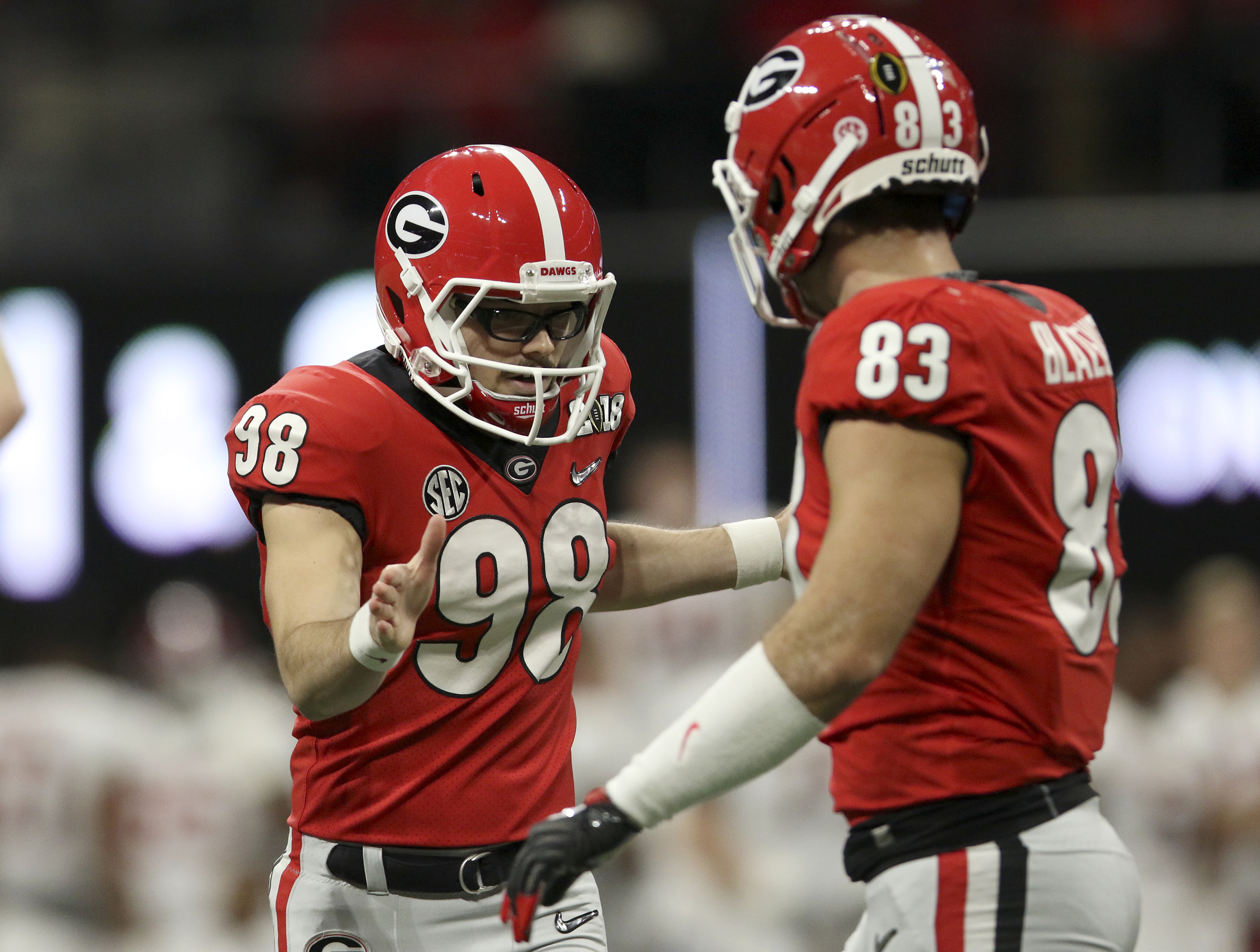 Georgia kicker Rodrigo Blankenship (98) celebrates with tight end Jeb Blazevich (83) after hitting a 41-yard field goal for the first points of the College Football Playoff national championship against Alabama at Mercedes-Benz Stadium on Monday, Jan. 8, 2018 in Atlanta, Ga.