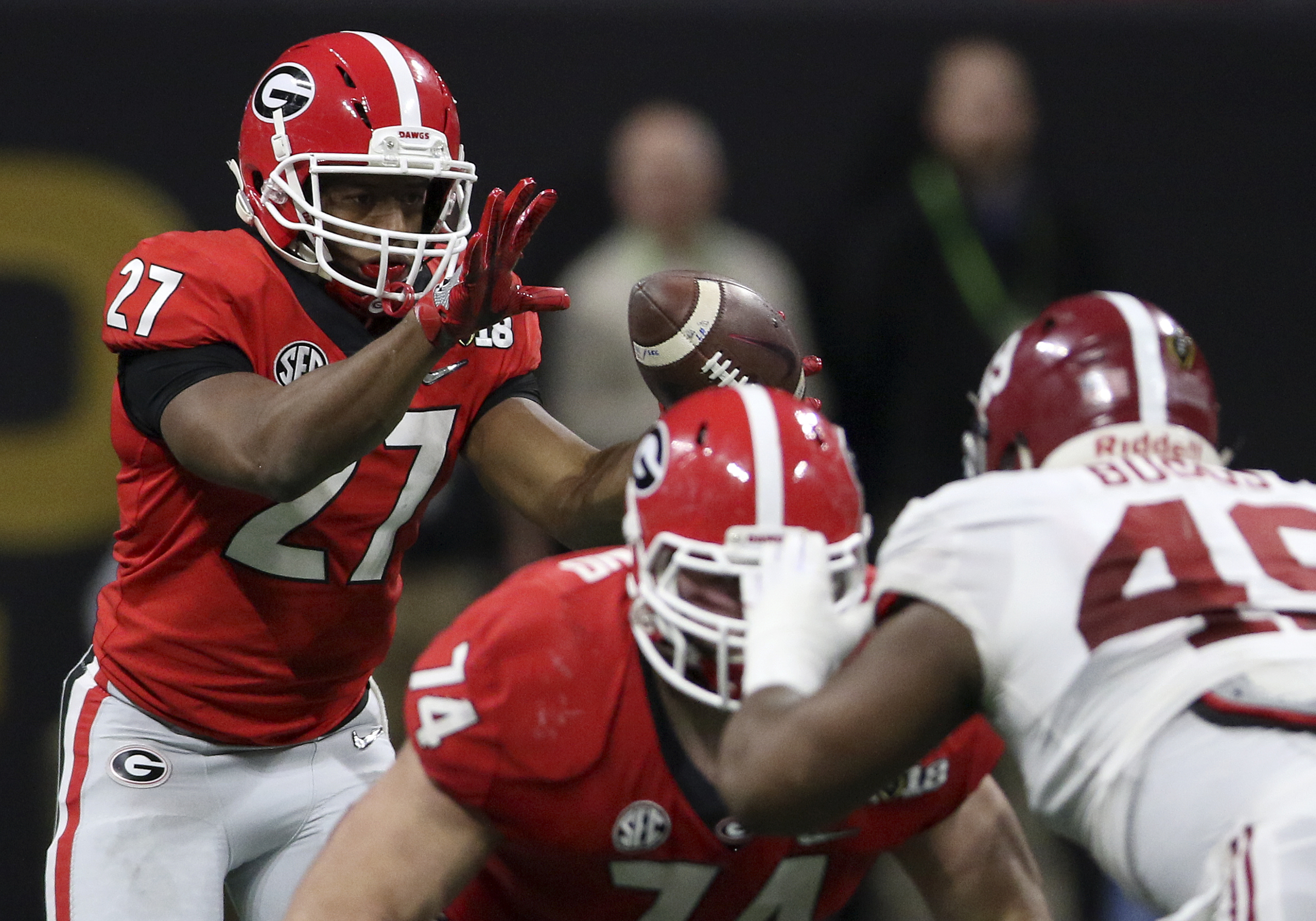 Georgia running back Nick Chubb (27) takes a direct snap against Alabama during the College Football Playoff national championship at Mercedes-Benz Stadium on Monday, Jan. 8, 2018 in Atlanta, Ga. Chubb would gain five yards on the play.