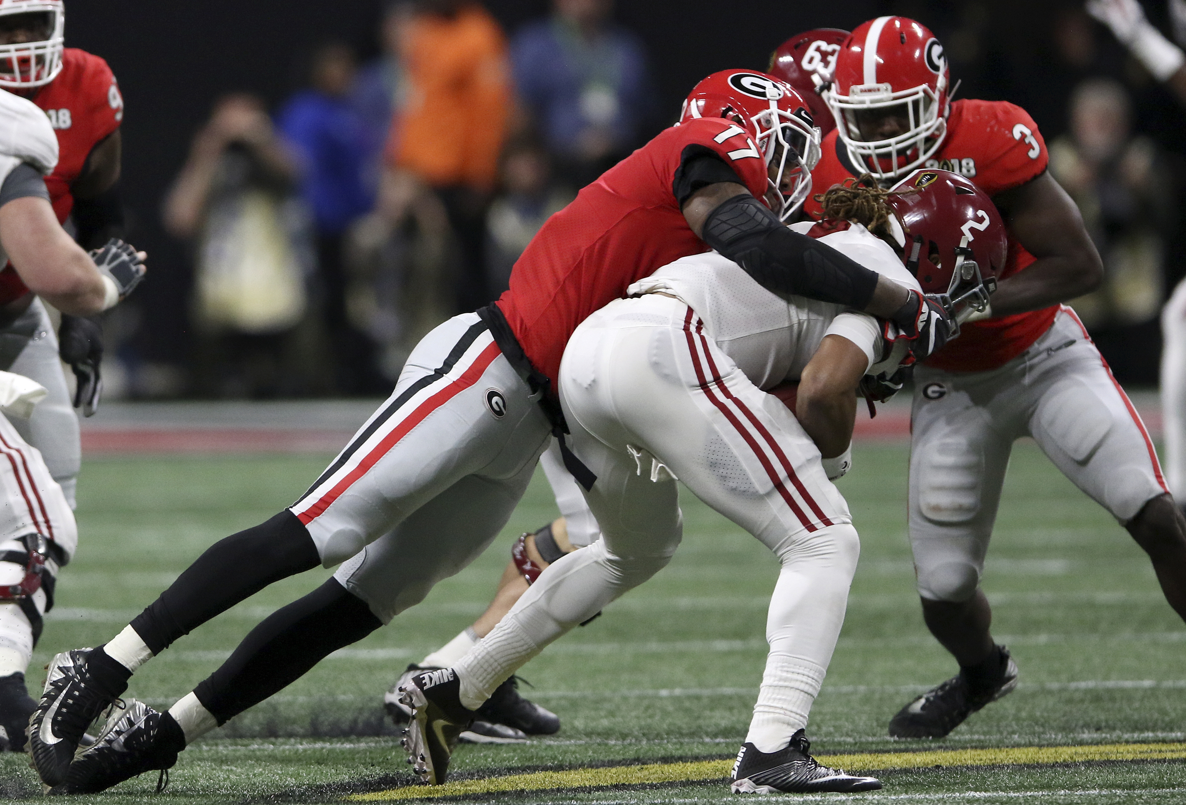 Georgia linebacker Davin Bellamy (17) sacks Alabama quarterback Jalen Hurts (2) for a 6-yard loss during the College Football Playoff national championship at Mercedes-Benz Stadium on Monday, Jan. 8, 2018 in Atlanta, Ga.