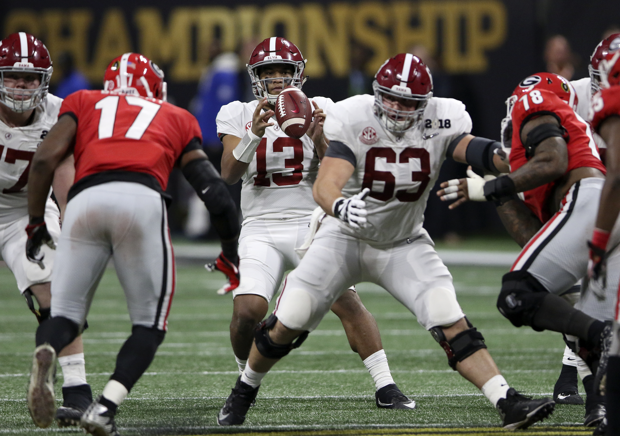 Alabama quarterback Tua Tagovailoa (13) takes the snap against Georgia during the College Football Playoff national championship at Mercedes-Benz Stadium on Monday, Jan. 8, 2018 in Atlanta, Ga.