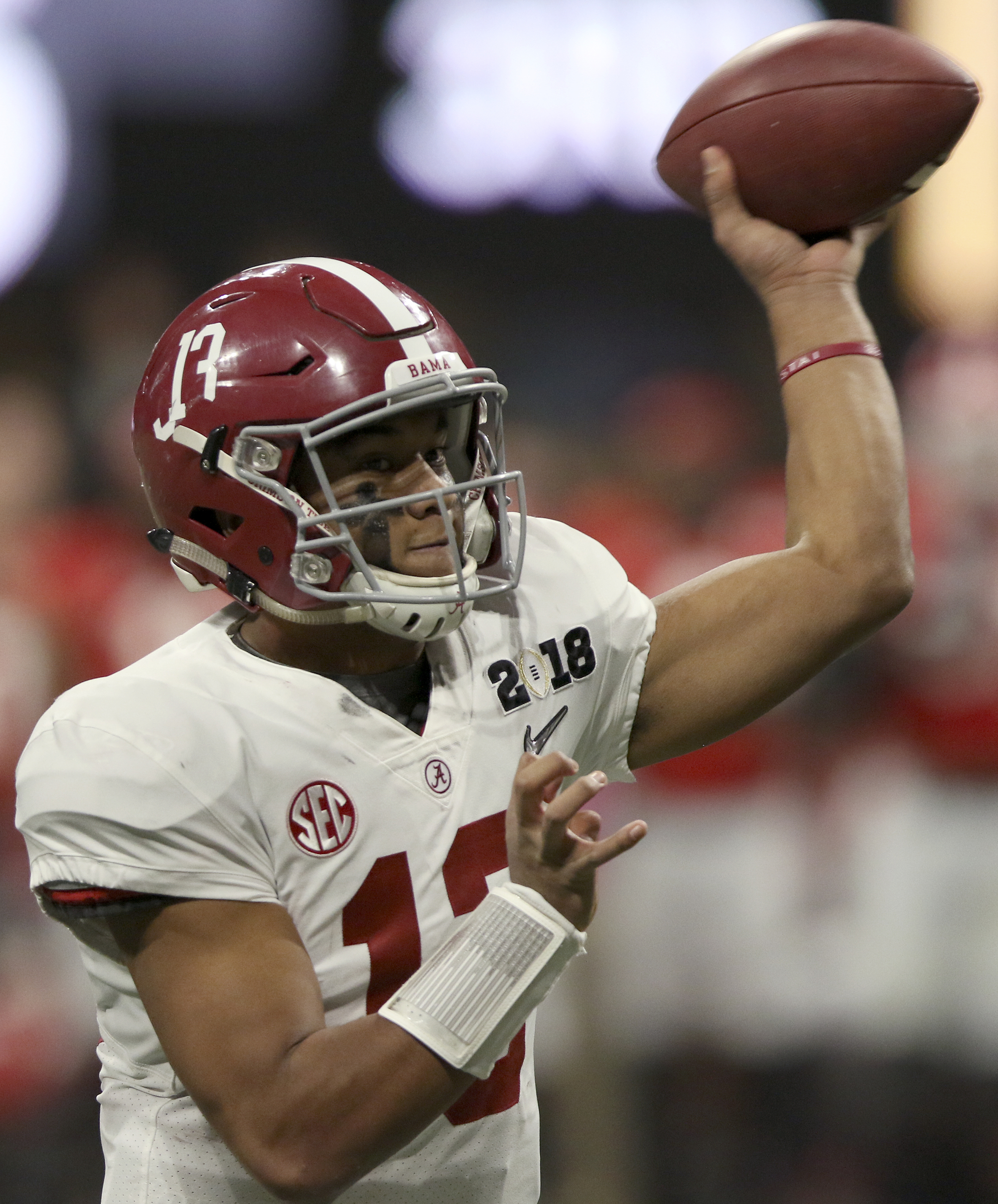 Alabama quarterback Tua Tagovailoa (13) throws a 6-yard touchdown pass against Georgia during the College Football Playoff national championship at Mercedes-Benz Stadium on Monday, Jan. 8, 2018 in Atlanta, Ga.