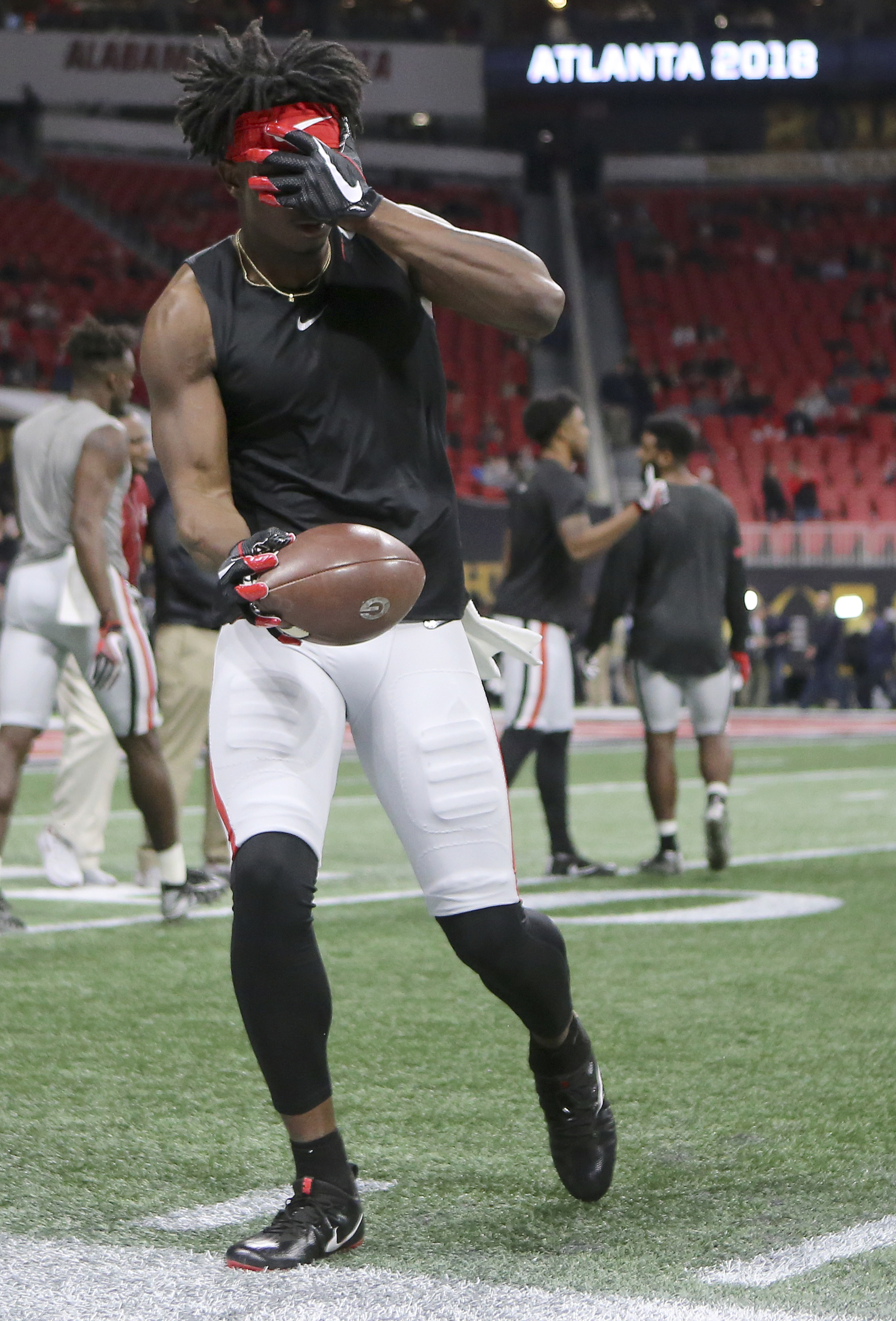 Georgia wide receiver Javon Wims tries to make a catch without looking while warming up before the College Football Playoff national championship against Alabama at Mercedes-Benz Stadium on Monday, Jan. 8, 2018 in Atlanta, Ga.
