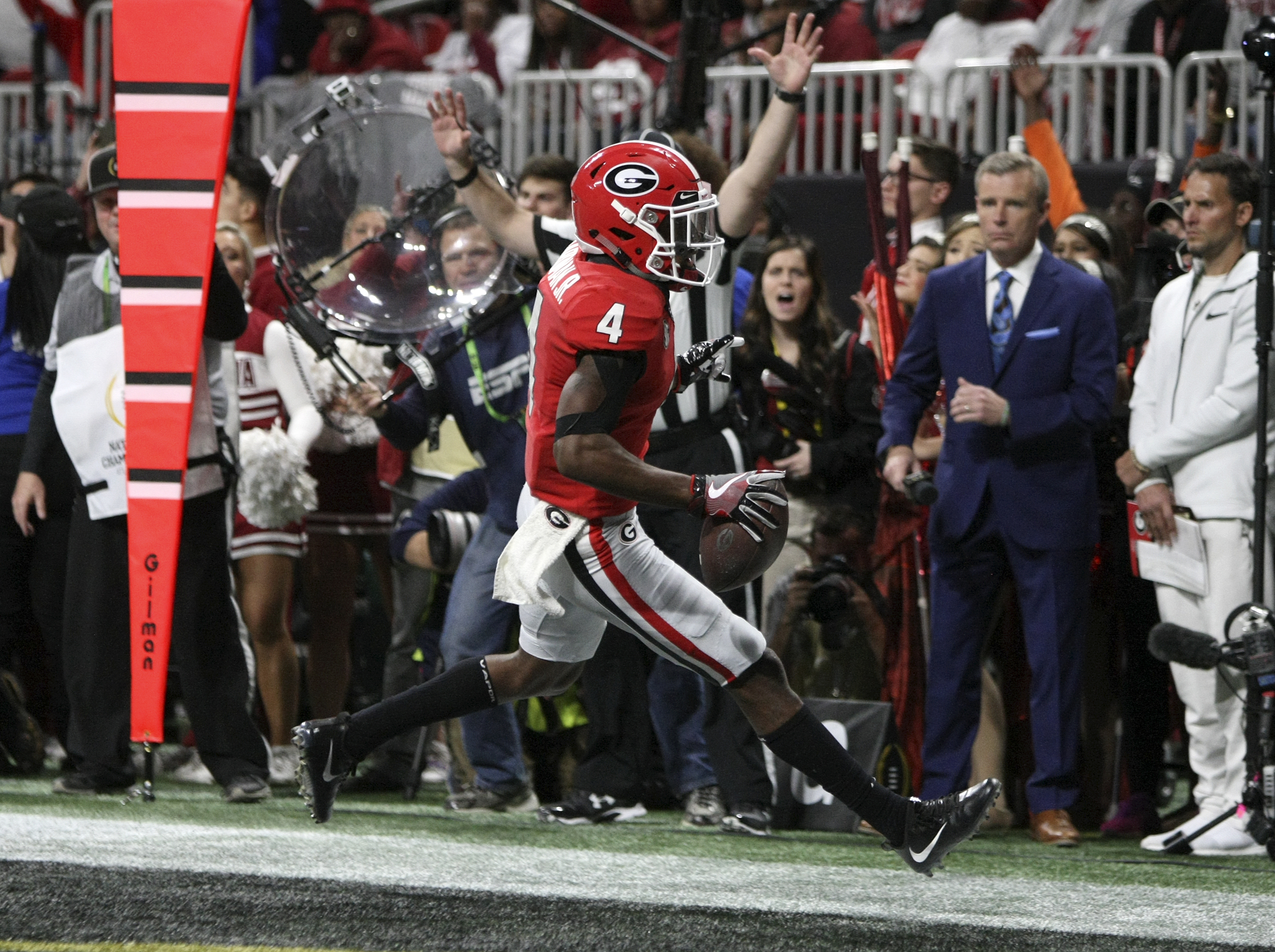 Georgia wide receiver Mecole Hardman Jr. (4) scores a 1-yard rushing touchdown against Alabama during the College Football Playoff national championship at Mercedes-Benz Stadium on Monday, Jan. 8, 2018 in Atlanta, Ga.