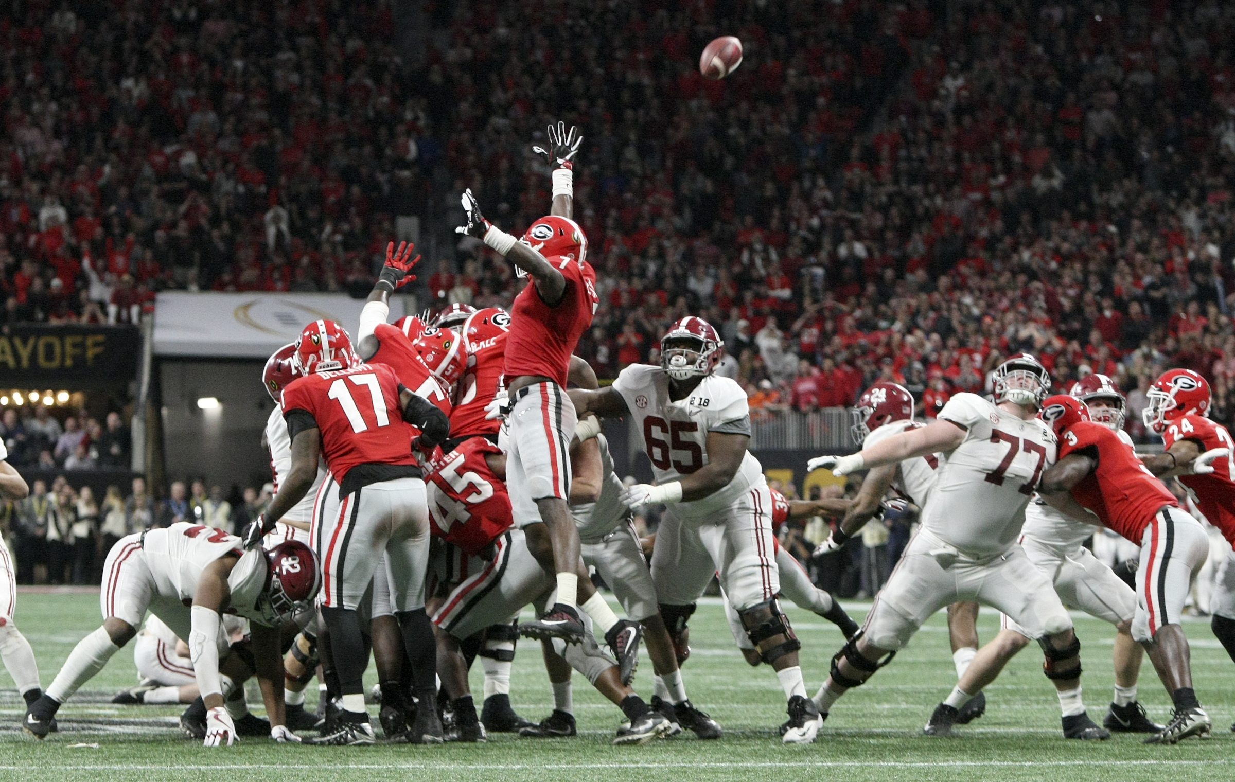 Alabama offensive lineman Matt Womack (77) looks towards the ball as kicker Andy Pappanastos' potential game-winning field goal fails to go through the uprights during the College Football Playoff national championship at Mercedes-Benz Stadium on Monday, Jan. 8, 2018 in Atlanta, Ga.
