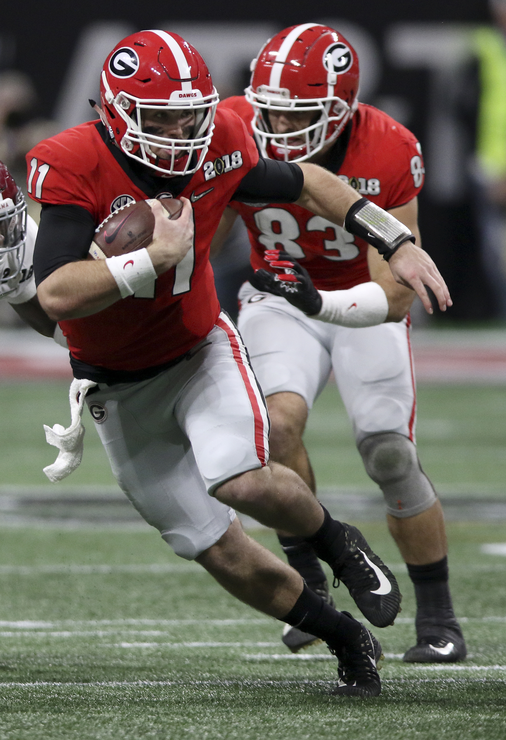 Georgia quarterback Jake Fromm (11) carries for a 5-yard gain against Alabama during the College Football Playoff national championship at Mercedes-Benz Stadium on Monday, Jan. 8, 2018 in Atlanta, Ga.