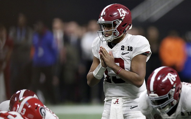 Alabama quarterback Tua Tagovailoa (13) signals before taking the snap during overtime of the College Football Playoff national championship against Georgia at Mercedes-Benz Stadium on Tuesday, Jan. 9, 2018 in Atlanta, Ga. Tagovailoa would through a 41-yard touchdown pass for the win on the play.