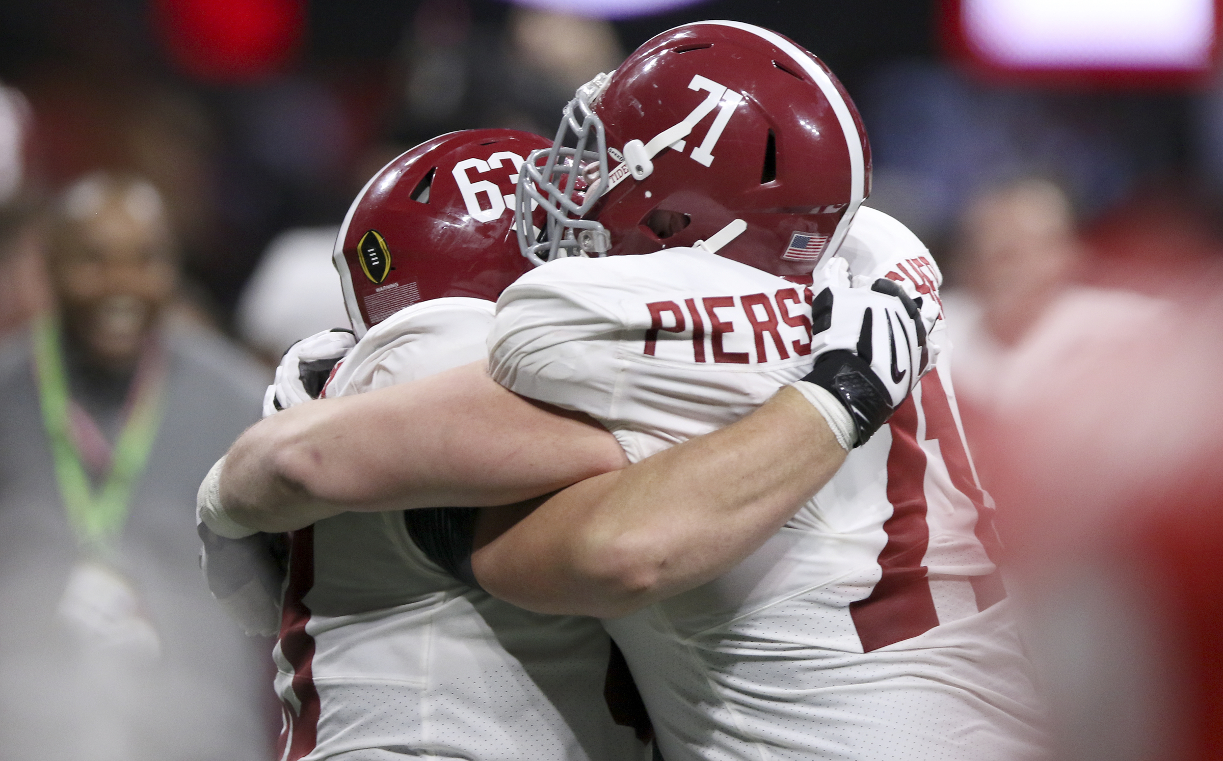 Alabama offensive linemen J.C. Hassenauer (63) and Ross Pierschbacher (71) celebrate their College Football Playoff national championship overtime victory over Georgia at Mercedes-Benz Stadium on Monday, Jan. 8, 2018 in Atlanta, Ga.