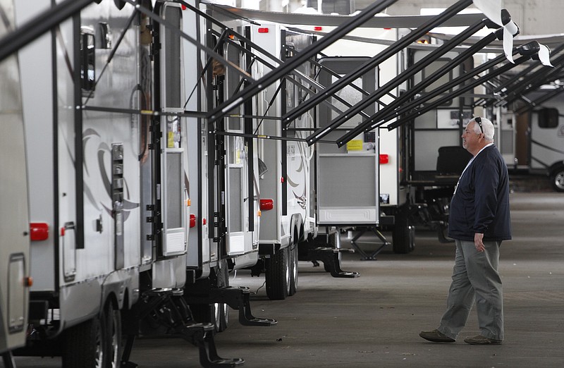 In this 2014, staff file photo, David Roberson with Dunlap RV looks over campers during the first day of the Chattanooga RV Show at the First Tennessee Pavilion.