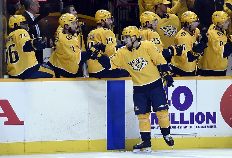 Nashville Predators left wing Viktor Arvidsson (33), of Sweden, is congratulated after against the Edmonton Oilers during the first period of an NHL hockey game Tuesday, Jan. 9, 2018, in Nashville, Tenn. (AP Photo/Mark Zaleski)