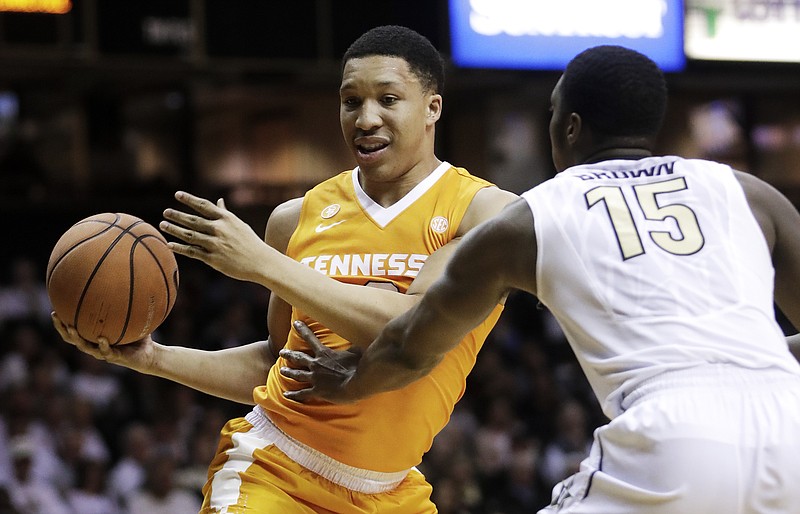 Tennessee forward Grant Williams, left, drives against Vanderbilt forward Clevon Brown (15) during the first half of an NCAA college basketball game Tuesday, Jan. 9, 2018, in Nashville, Tenn. (AP Photo/Mark Humphrey)