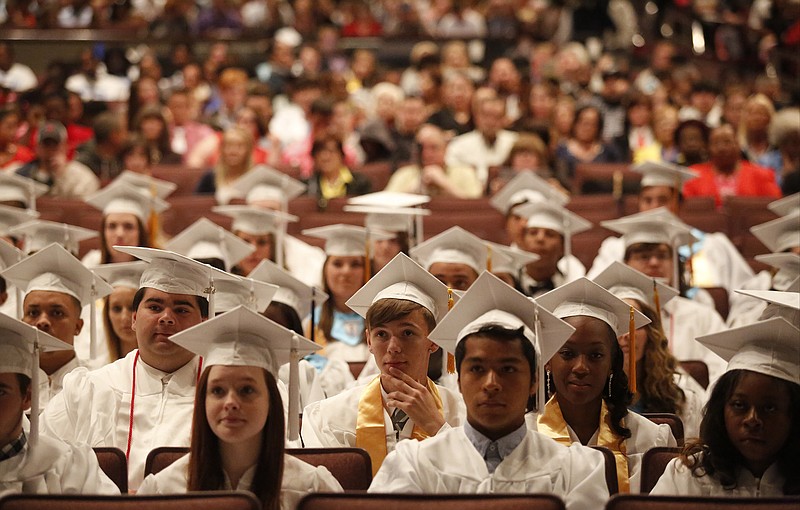 Graduating seniors listen to a speaker during East Ridge High School's 2014 commencement ceremony at Memorial Auditorium in Chattanooga.