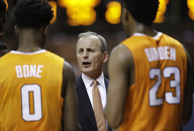 Tennessee coach Rick Barnes talks with Jordan Bone (0) and Jordan Bowden (23) during a timeout in the second half of the team's NCAA college basketball game against Vanderbilt on Tuesday, Jan. 9, 2018, in Nashville, Tenn. Tennessee won 92-84. (AP Photo/Mark Humphrey)