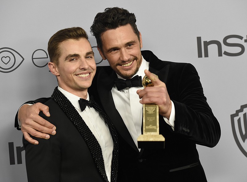 In this Jan. 7, 2018, file photo, Dave Franco, left, poses with James Franco, winner of the award for best performance by an actor in a motion picture - musical or comedy for "The Disaster Artist," at the InStyle and Warner Bros. Golden Globes afterparty in Beverly Hills, Calif. The New York Times has canceled a public event with James Franco days after the Golden Globe winner was accused of sexual misconduct. The TimesTalk event scheduled for Wednesday, Jan. 10, was intended to feature "The Disaster Artist" director and star and his brother and co-star, Dave Franco, discussing the film with a Times reporter. The Times said in a statement that "given the controversy surrounding recent allegations" it was canceling the event. (Photo by Chris Pizzello/Invision/AP, File)