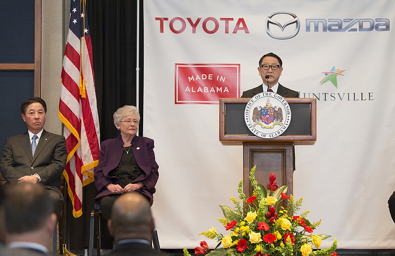 Akio Toyoda, right, Toyota Motor Corp., speaks as Alabama Gov. Kay Ivey, center, Masamichi Kogai, Mazda Motor Corp. president and CEO, listen during a press conference, Wednesday, Jan. 10, 2018, in Montgomery, Ala., where the Japanese automakers announced plans to build a huge $1.6 billion joint-venture plant in Huntsville, that will eventually employ about 4,000 people. Several states had competed for the coveted project, which will be able to turn out 300,000 vehicles per year and will produce the Toyota Corolla compact car for North America and a new small SUV from Mazda. (Albert Cesare/The Montgomery Advertiser via AP)