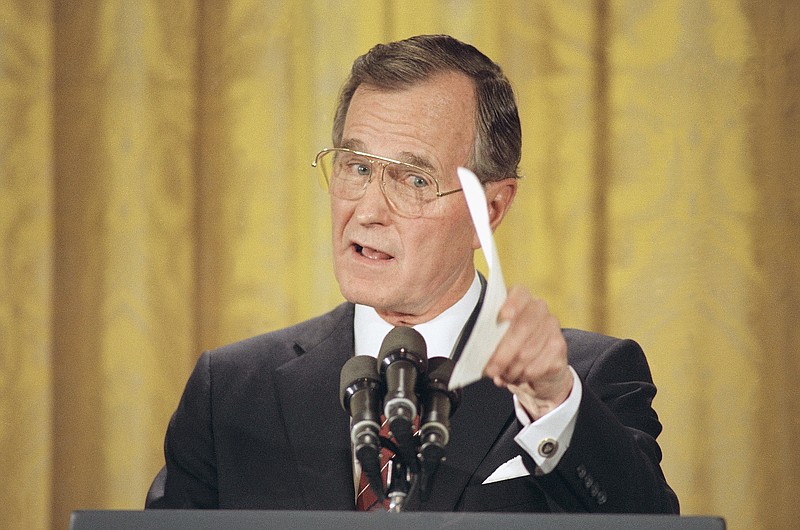 Former President George H.W. Bush, pictured in his first presidential prime-time televised news conference, lived to regret breaking his "no new taxes" pledge.