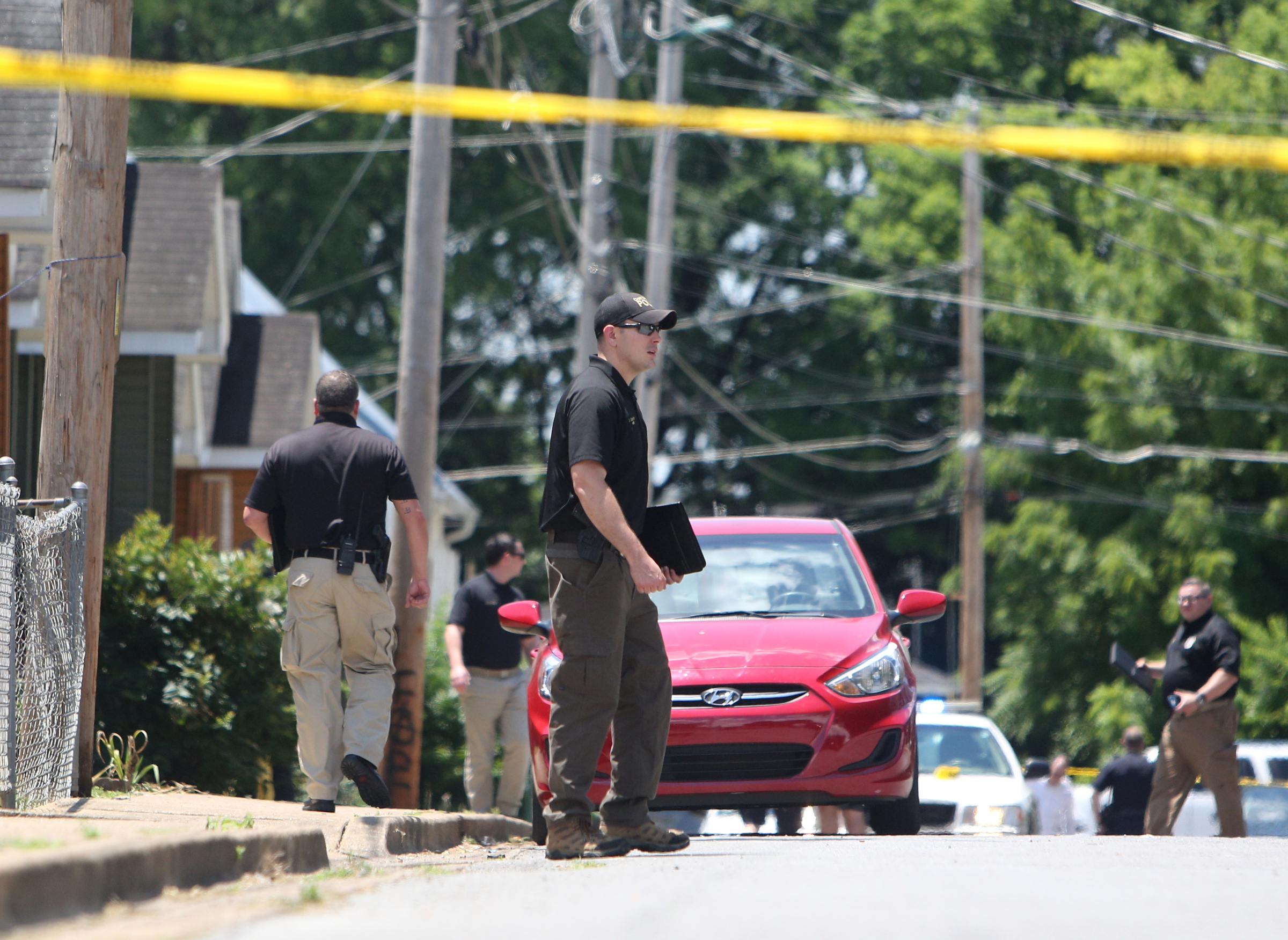 The Chattanooga Police Department work the scene of a shooting shooting that was called in at 12:30 p.m. Thursday, June 15, 2017, at O'Neal Street about halfway between Cleveland Avenue and Blackford Street in Chattanooga, Tenn. The Chattanooga Police Department is working with community members to gain suspect information.