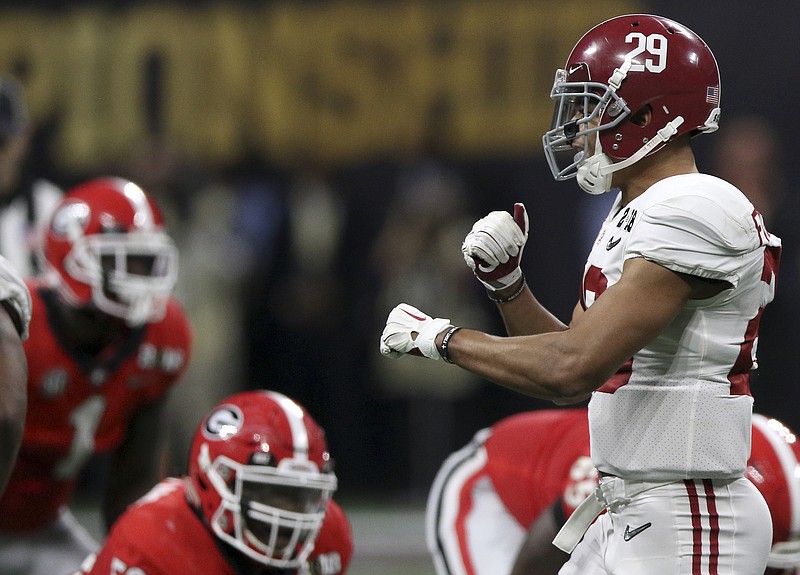 Alabama defensive back Minkah Fitzpatrick signals before a Georgia snap during Monday night's College Football Playoff final at Mercedes-Benz Stadium. He is leaving the Crimson Tide for an NFL opportunity.