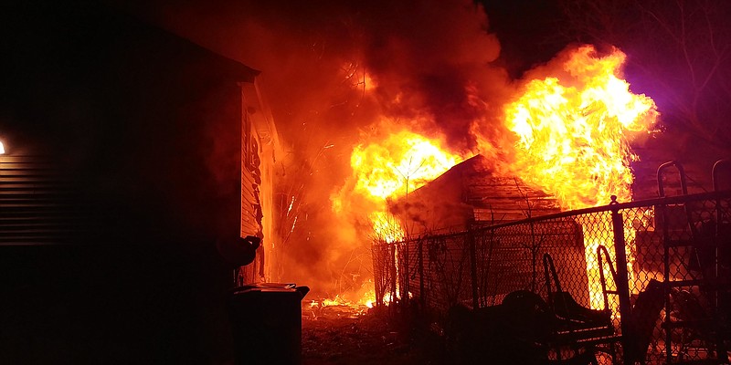 Chattanooga firefighters work to extinguish a fire on the 1800 block of East 26th Street on Wednesday, Jan. 10, 2018. A large shed was destroyed and two homes damaged by the blaze. (Chief Michael W. Crites/Tennessee Protective Services)