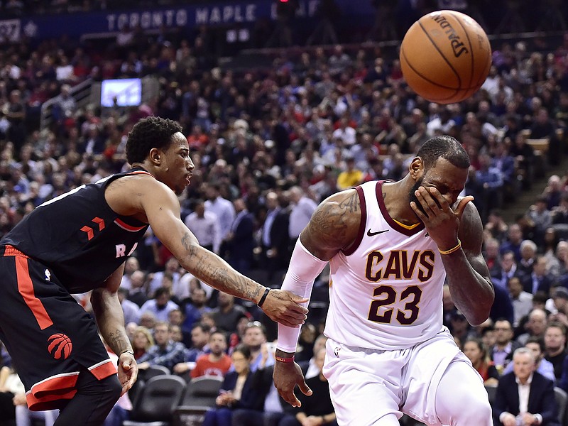 
              Cleveland Cavaliers forward LeBron James (23) reacts after being fouled by Toronto Raptors guard DeMar DeRozan, left, during the second half of an NBA basketball game Thursday, Jan. 11, 2018, in Toronto. (Frank Gunn/The Canadian Press via AP)
            