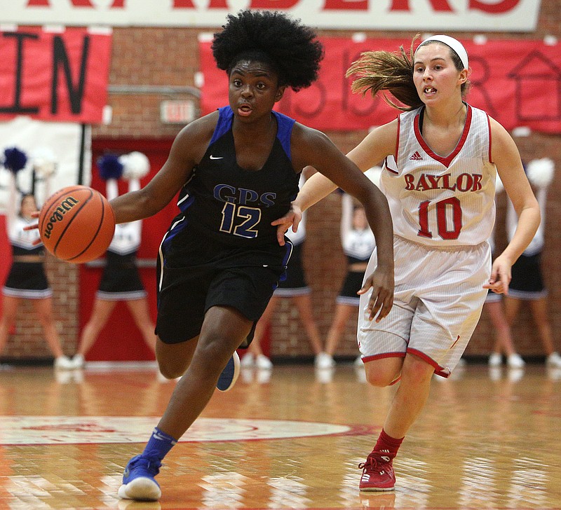 Girls Preparatory School's JJ Dunigan (12) dribbles the ball downcourt while being guarded by Baylor School's Britt Barton (10) during the Baylor vs. GPS girls basketball game Thursday, Jan. 11, 2018, at Baylor School in Chattanooga, Tenn.