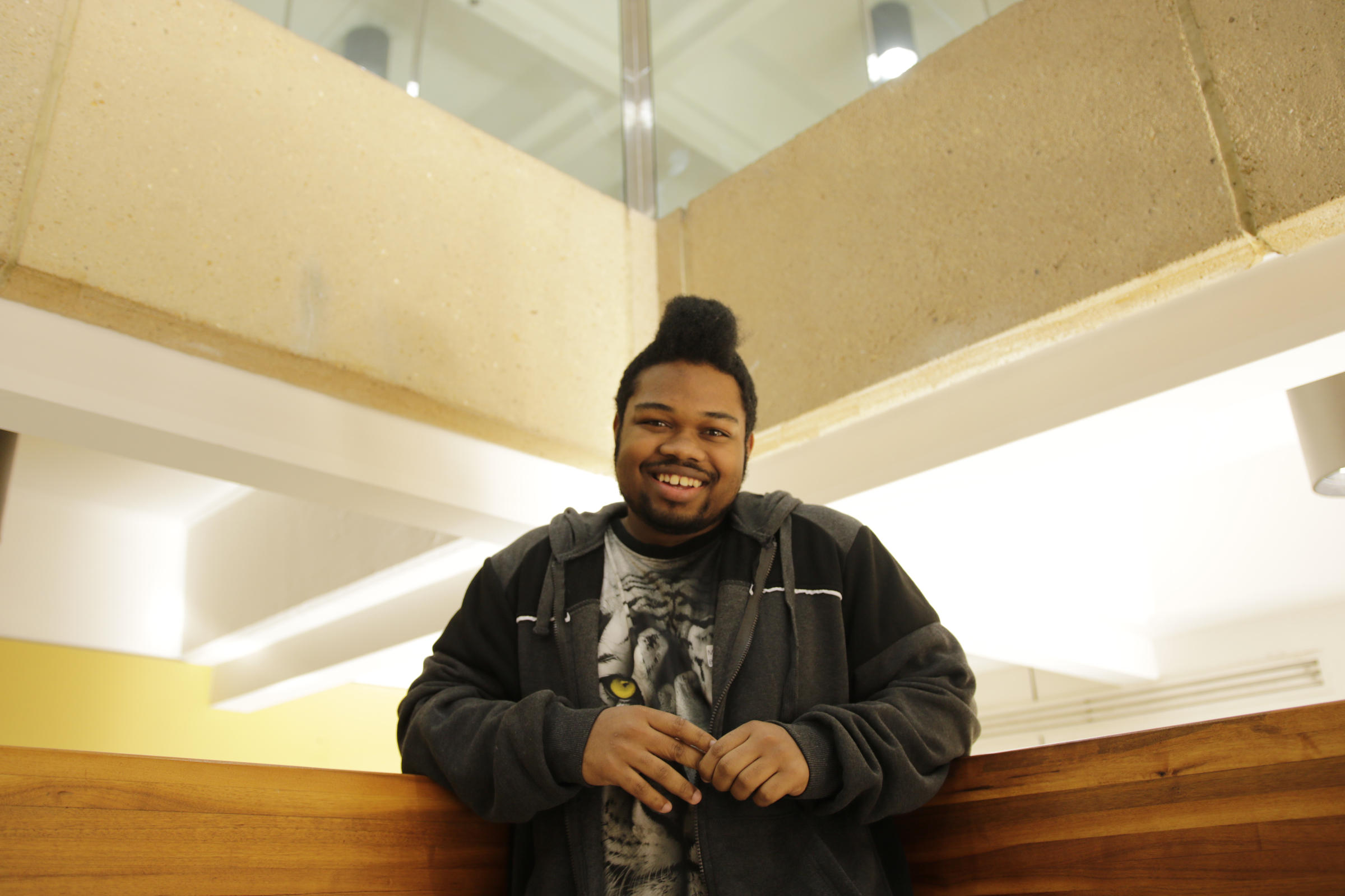 Marshun Burgess, who is a freshman at Miles College, poses for a portrait at a check-in for students from the GEAR UP college readiness program at the University of Tennessee at Chattanooga on Thursday, Jan. 4, 2018, in Chattanooga, Tenn. GEAR UP begins academic counseling and a support system for underserved students as early as 6th grade.