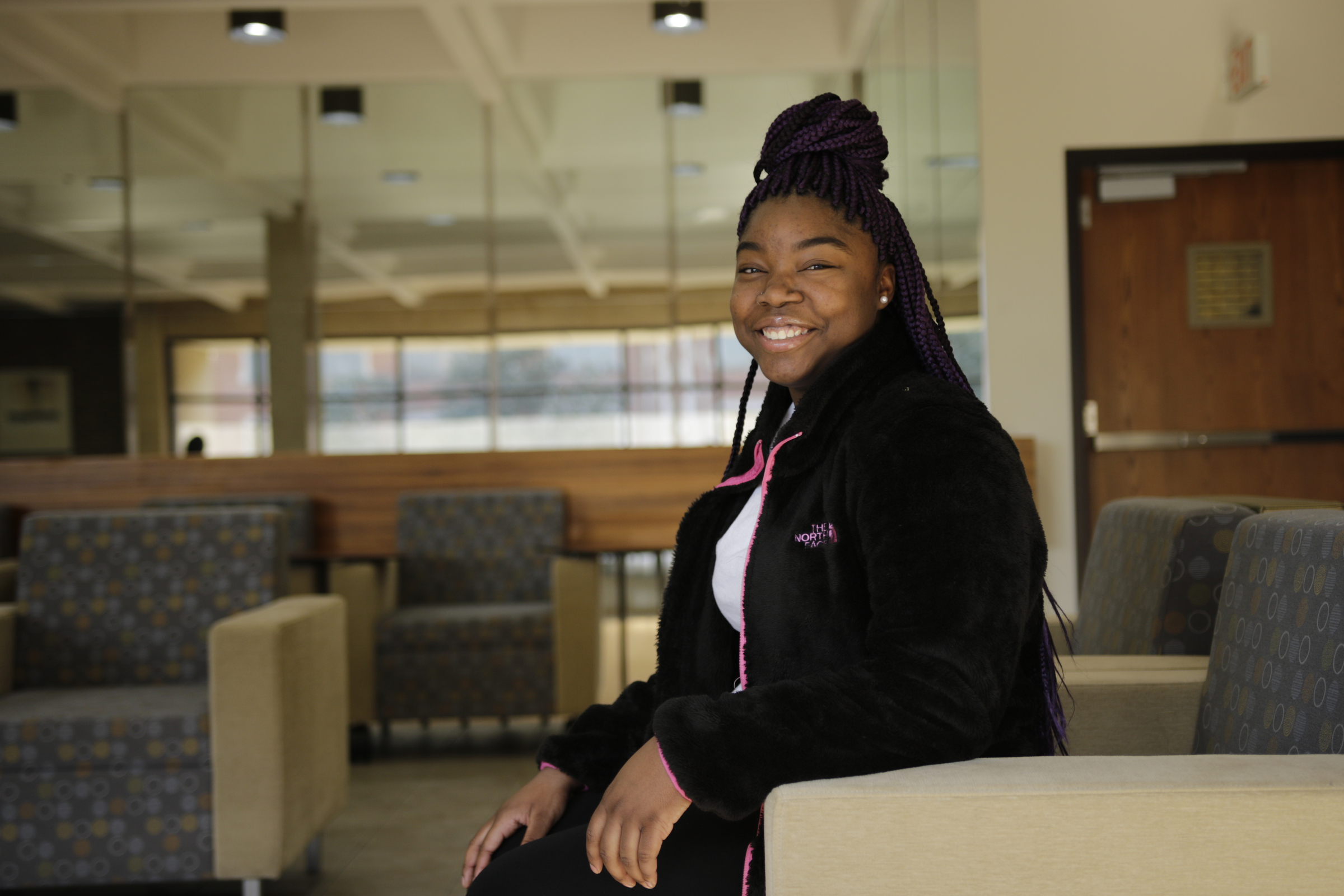 ETSU freshman Jateria Beamon poses for a portrait at a check-in for students from the GEAR UP college readiness program at the University of Tennessee at Chattanooga on Thursday, Jan. 4, 2018, in Chattanooga, Tenn. GEAR UP begins academic counseling and a support system for underserved students as early as 6th grade.