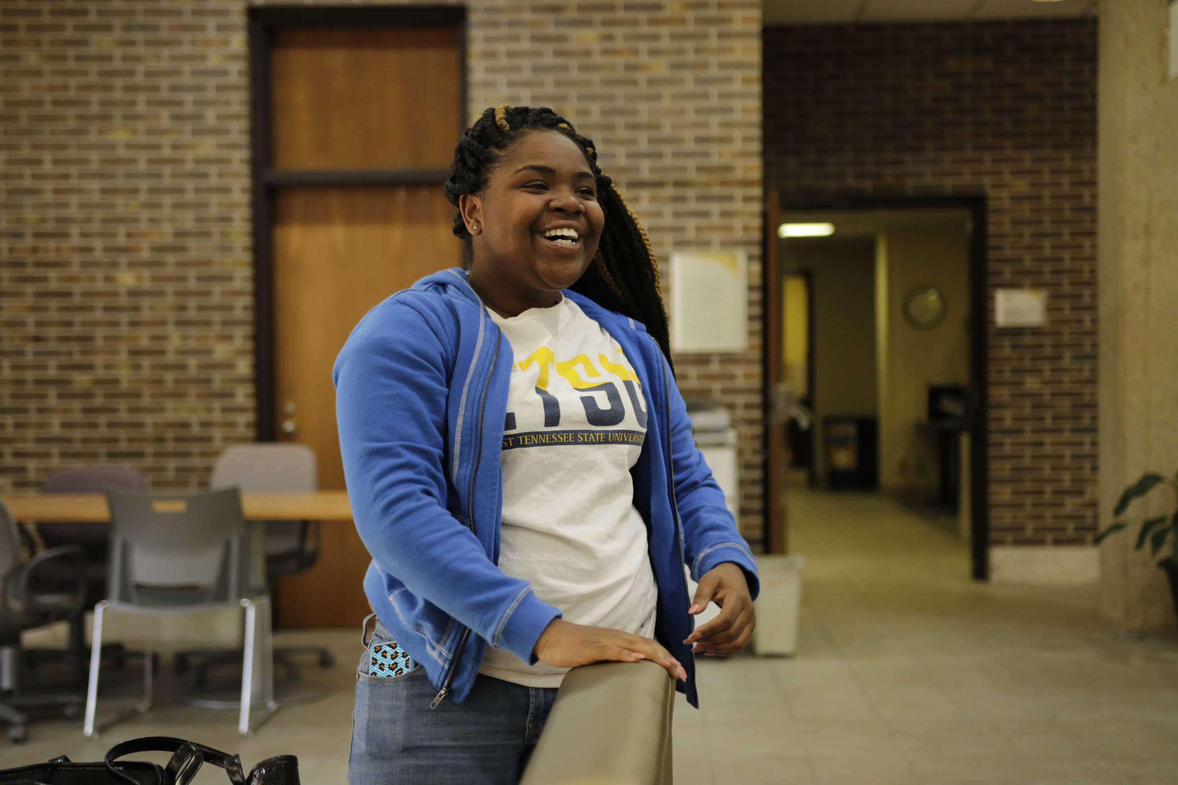 ETSU freshman Laquisha Smartt poses for a portrait at a check-in for students from the GEAR UP college readiness program at the University of Tennessee at Chattanooga on Thursday, Jan. 4, 2018, in Chattanooga, Tenn. GEAR UP begins academic counseling and a support system for underserved students as early as 6th grade.