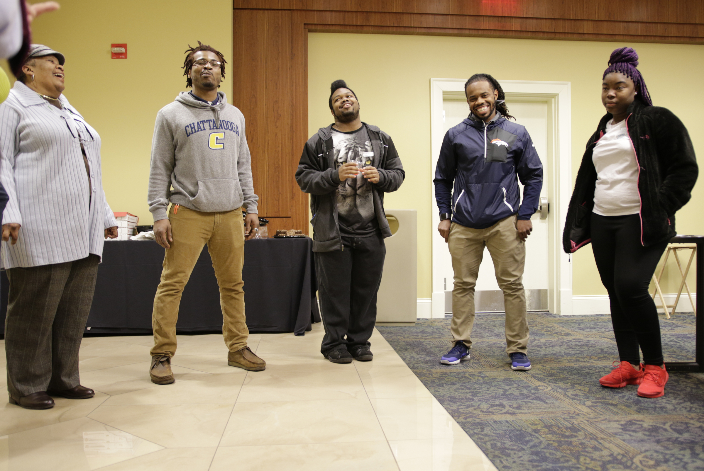 Students and workers participate in an icebreaker at a check-in for students from the GEAR UP college readiness program at the University of Tennessee at Chattanooga on Thursday, Jan. 4, 2018, in Chattanooga, Tenn. GEAR UP begins academic counseling and a support system for underserved students as early as 6th grade.