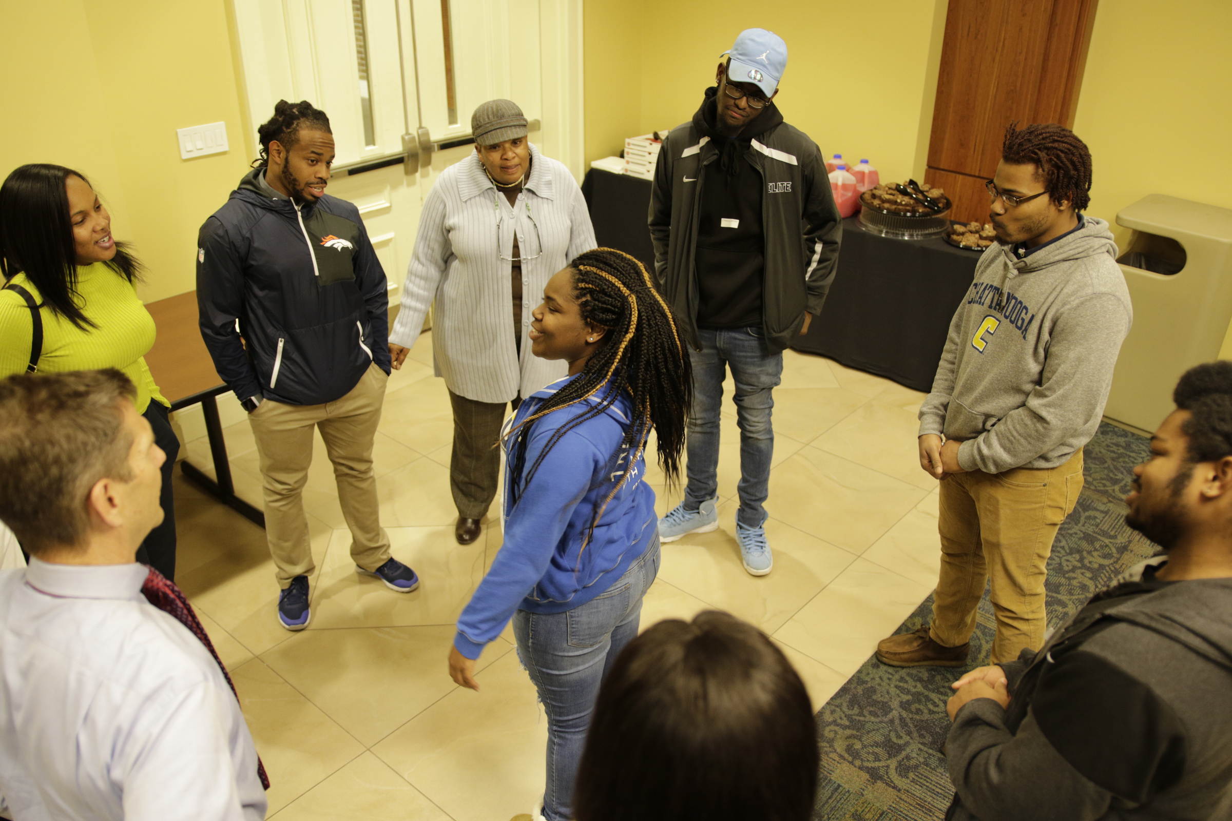 Students and workers participate in an icebreaker at a check-in for students from the GEAR UP college readiness program at the University of Tennessee at Chattanooga on Thursday, Jan. 4, 2018, in Chattanooga, Tenn. GEAR UP begins academic counseling and a support system for underserved students as early as 6th grade.