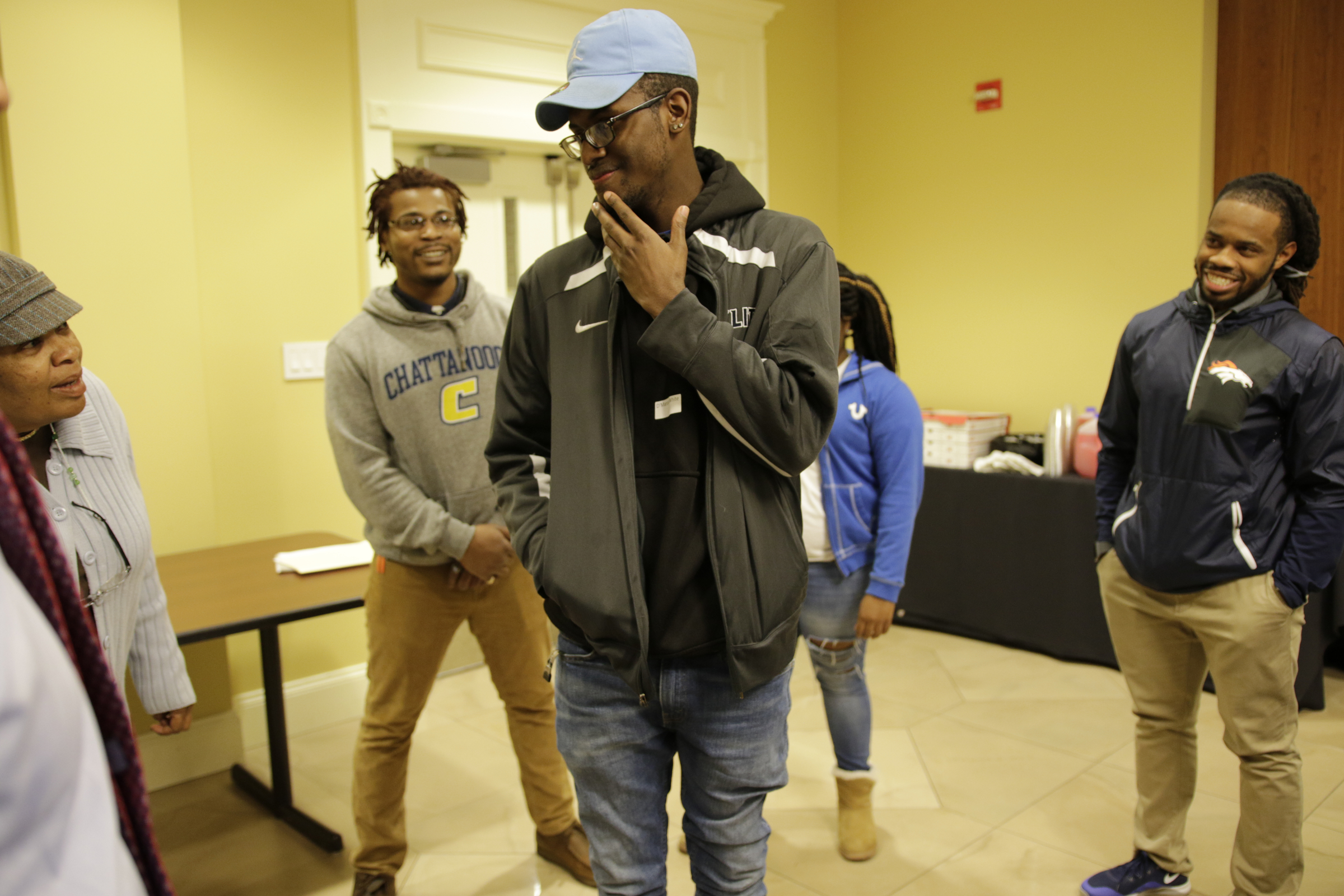 D'Marcus White participates in an icebreaker at a check-in for students from the GEAR UP college readiness program at the University of Tennessee at Chattanooga on Thursday, Jan. 4, 2018, in Chattanooga, Tenn. GEAR UP begins academic counseling and a support system for underserved students as early as 6th grade.