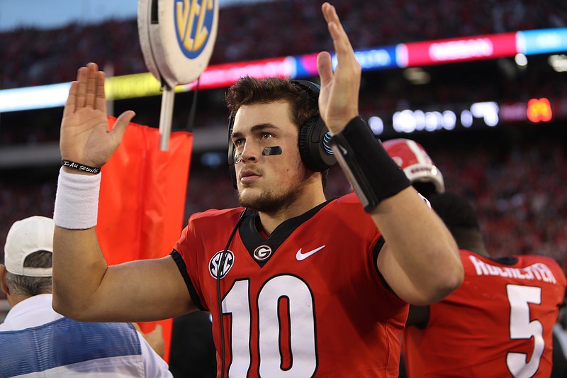 Georgia quarterback Jacob Eason signals a touchdown from the sideline during the 42-13 win over Kentucky in November.