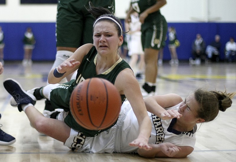 Notre Dame's Kate Ford (11) collides with Chattanooga Christian's Katie Davick (11) during a game at Chattanooga Christian School on Friday, Jan. 12, 2018 in Chattanooga, Tenn.