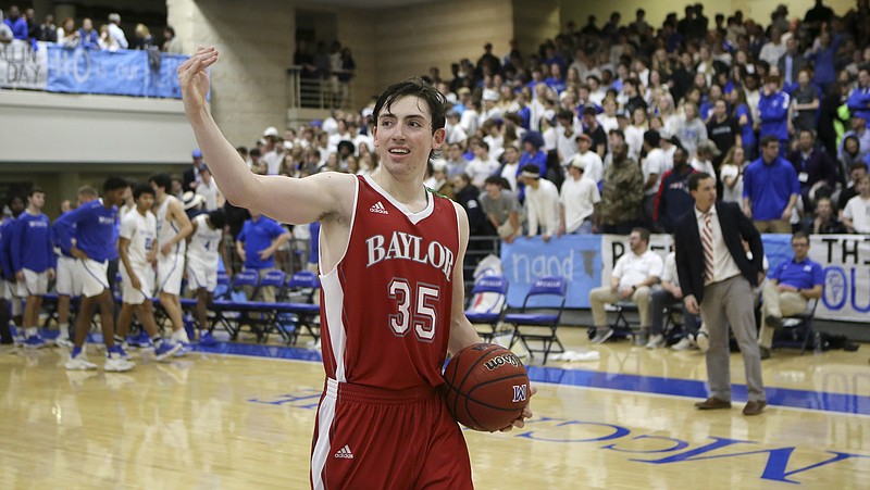 Baylor's Patrick Urey (35) gestures towards the Baylor fans after the Red Raiders defeated the McCallie Blue Tornado at the Walker Forum on the campus of McCallie School on Friday, Jan. 12, 2018 in Chattanooga, Tenn.