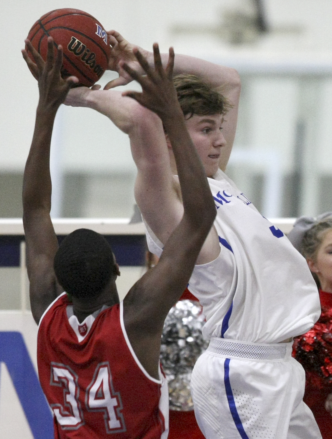 Baylor's Randy Brady (34) defends McCallie's Trip Butler (5) as Butler passes the ball at the Walker Forum on the campus of McCallie School on Friday, Jan. 12, 2018 in Chattanooga, Tenn.