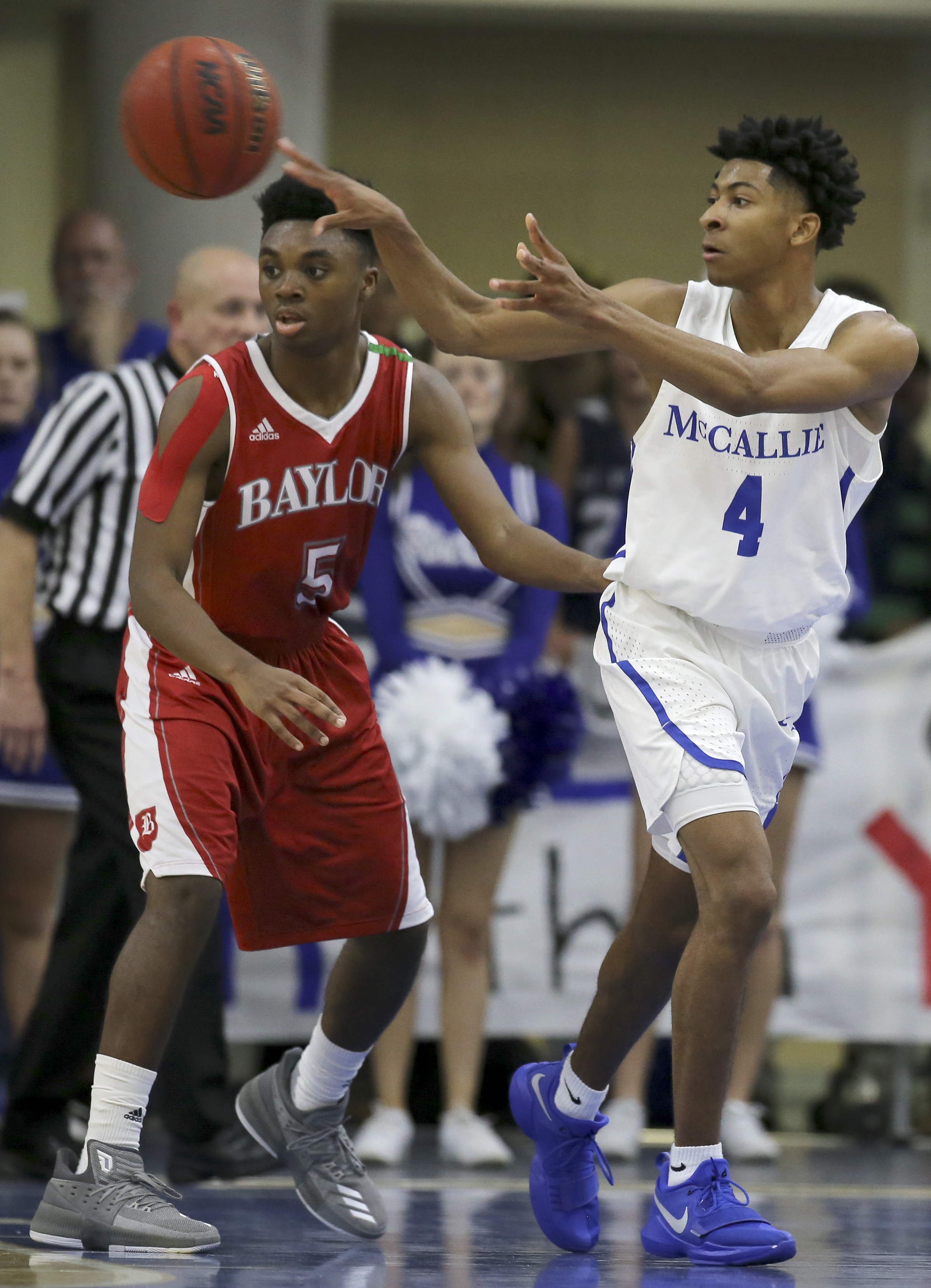 McCallie's Junior Clay (4) passes the ball against Tre Jackson (5) and Baylor at the Walker Forum on the campus of McCallie School on Friday, Jan. 12, 2018 in Chattanooga, Tenn.