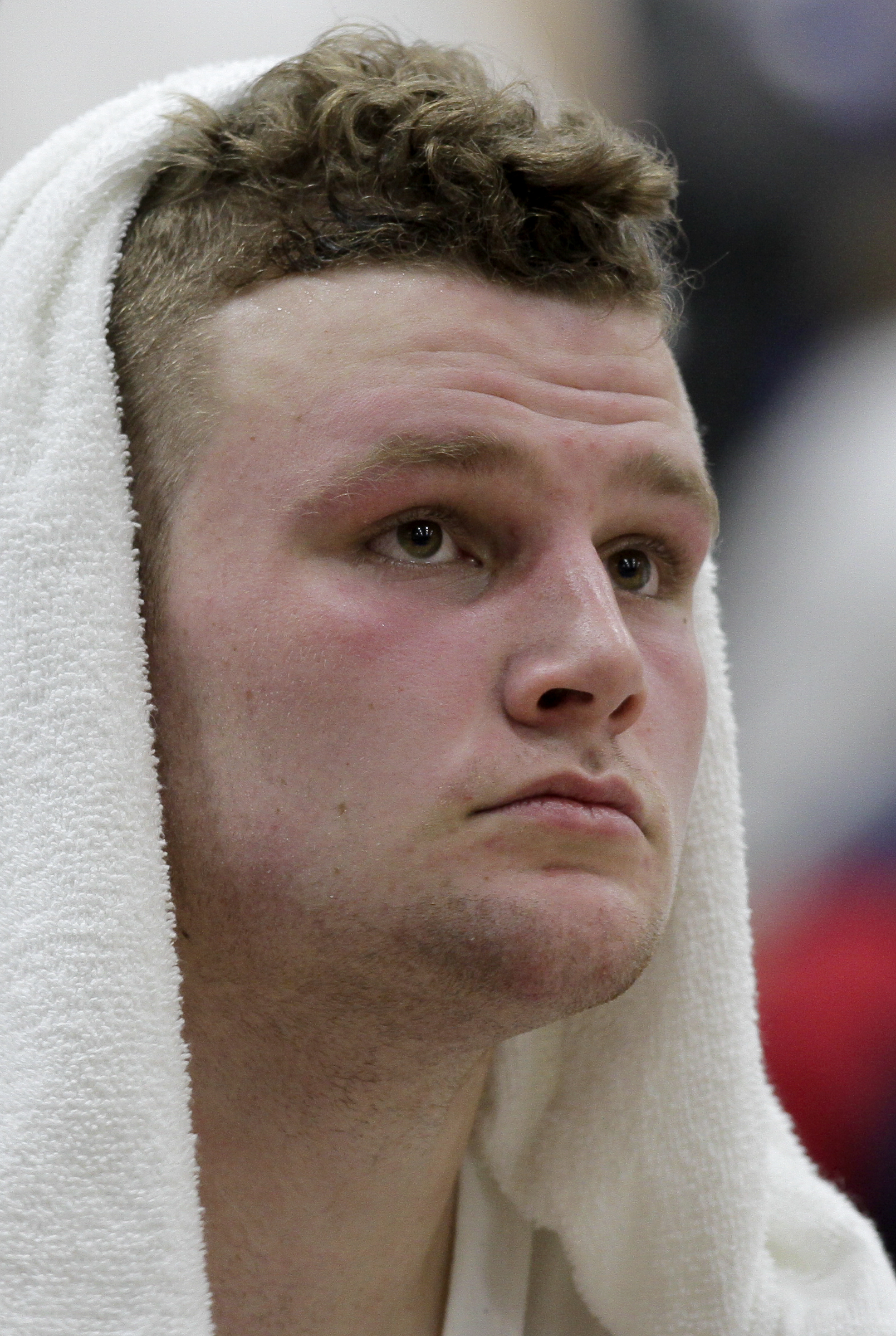 McCallie's Jay Gibson (10) sits on the bench with a towel over his head during the Blue Tornado's game against Baylor at the Walker Forum on the campus of McCallie School on Friday, Jan. 12, 2018 in Chattanooga, Tenn.