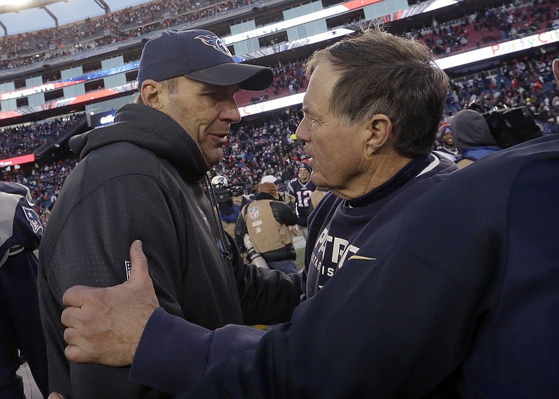 FILE - In this Dec. 20, 2015, file photo, Tennessee Titans then-interim head coach Mike Mularkey, left, speaks to New England Patriots head coach Bill Belichick after their NFL football game, in Foxborough, Mass. The Titans and Patriots play in a divisional playoff game on Saturday, Jan. 13, 2018, in Foxborough, Mass. (AP Photo/Steven Senne, File)

