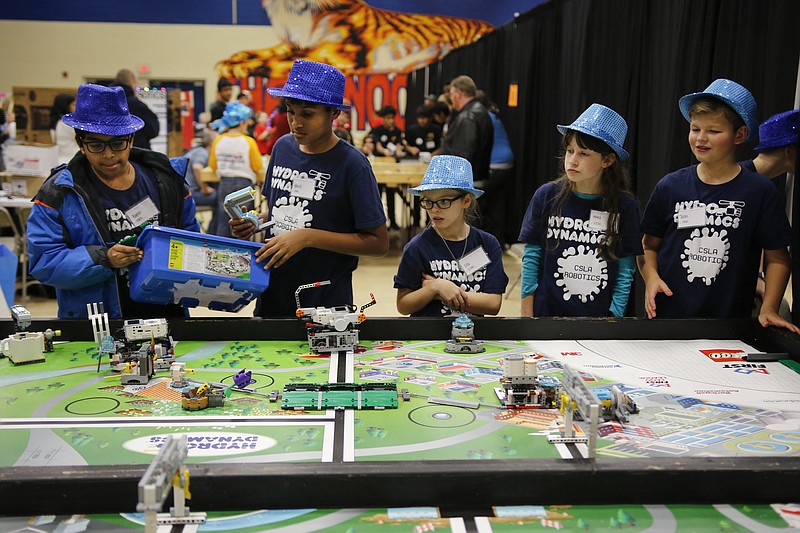 The CSLA robotics team tests their robot in the warmup pit at the TVA SuperRegional Robotics FIRST LEGO League Tournament in the Chattanooga State Technical Community College gymnasium on Saturday, Jan. 13, 2018, in Chattanooga, Tenn. Teams from across the region competed in the second round of qualifying competition, and winning teams will compete at Georgia Tech on January 27.