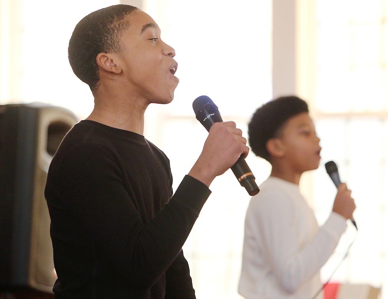 Mateo Tibbs, 13, and Manuel Tibbs, 11, with Pilgrim Rest Baptist Church Youth Group sing "Glory" during a Martin Luther King Birthday Party Celebration Sunday, Jan. 14, 2018 at St. James Baptist Church in Chattanooga, Tenn. The event has been held for about 20 years by the Unity Group of Chattanooga.