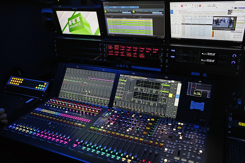 
              The mixing and editing desk at RT France is pictured in Paris, Tuesday, Jan. 9, 2018. Russian state broadcaster RT, formerly known as Russia Today, already broadcasts in English, Spanish, and Arabic, and has launched a French-language channel on Dec. 18. French President Emmanuel Macron’s plan for a law against false information around election campaigns is drawing criticism from media advocates, tech experts and others. They say it’s impossible to enforce and smacks of methods used by authoritarians, not democracies. (AP Photo/Francois Mori)
            