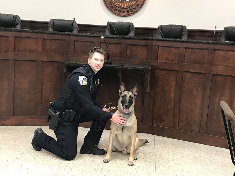 K9 Officer Kyle Dennis of the Red Bank Police Department poses with Harry, the department's new multipurpose dog used for narcotics tracking and criminal apprehension. (Staff photo by Emily Crisman)