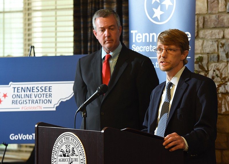 In this Sept. 6, 2017, staff file photo, Kerry Steelman, Hamilton County election administrator, speaks alongside Tennessee Secretary of State Tre Hargett in Hixson, Tenn. Secretary Hargett was launching the state's new online voter registration system