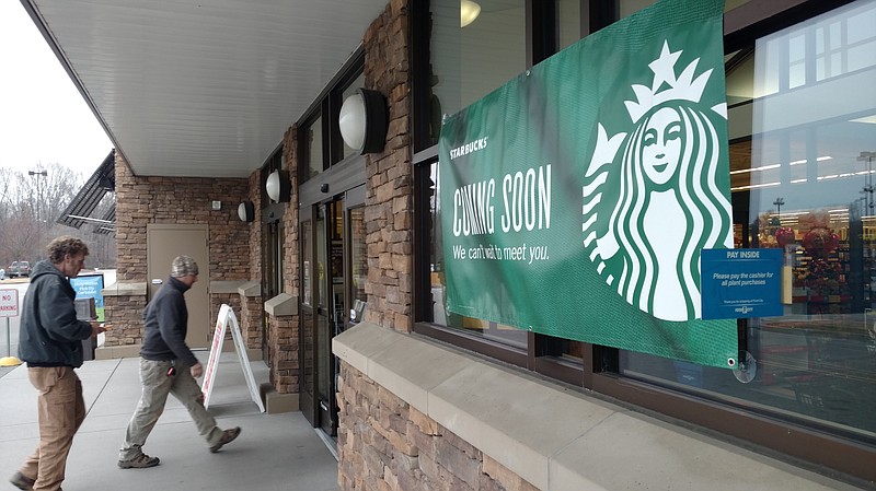 Customers of Food City's store at 5604 Hixson Pike are greeted by a Starbucks sign. The supermarket is slated to see a Starbucks coffee shop in March.