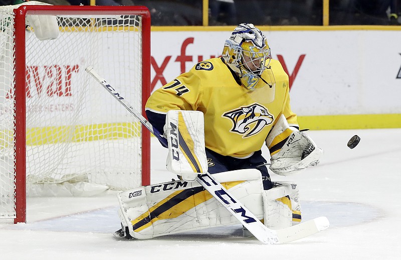 Nashville Predators goalie Juuse Saros, of Finland, blocks a shot against the Vegas Golden Knights in the first period of an NHL hockey game Tuesday, Jan. 16, 2018, in Nashville, Tenn. (AP Photo/Mark Humphrey)